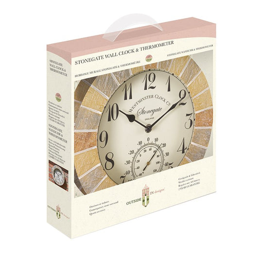 A boxed wall clock and thermometer set shown on a plain white background. The packaging features a large photo of the clock face and text reading 'STONEGATE WALL CLOCK & THERMOMETER' and 'HOMINGE'.