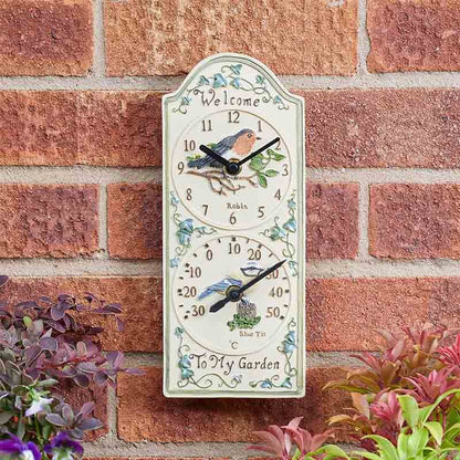 12-inch Birdberry wall clock and thermometer with weather-resistant hand-painted polyresin finish for indoor and outdoor use on outside brickwall