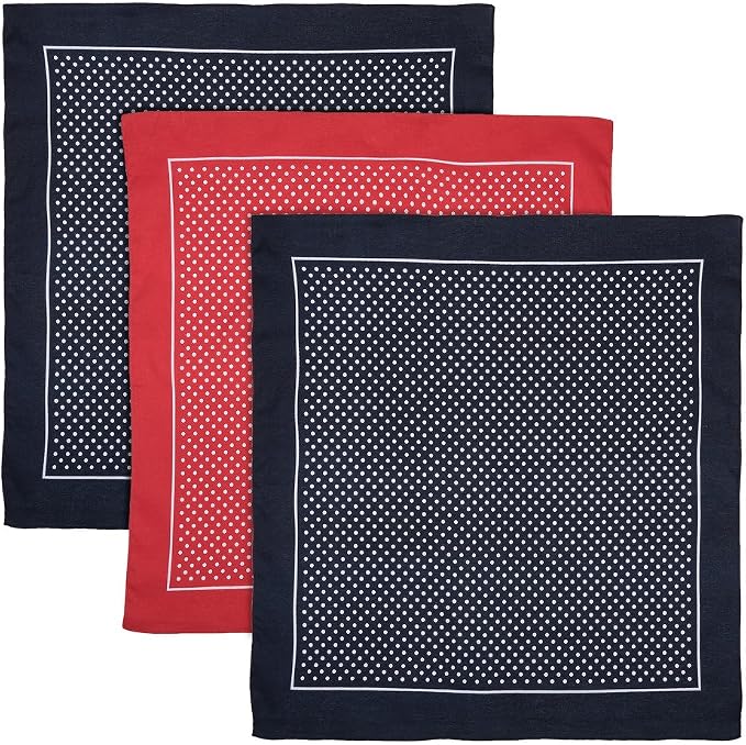 Three square hankies on a white background. The front piece is dark navy blue with a white dotted pattern and white border.
