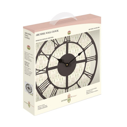 Boxed Arundel wall clock shown in its retail packaging, with a cream-colored box, a pink top panel, and a large printed image of the clock face on the front.