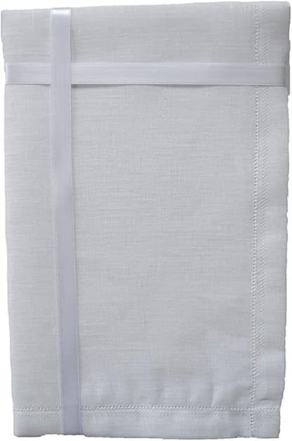 A folded white linen table linen or napkin with a stitched border and a matching white elastic band wrapped around it, shown on a plain white background.