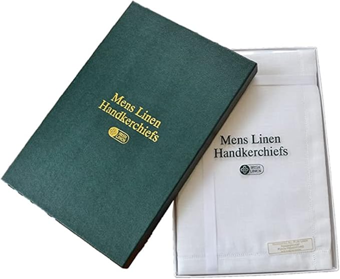 A dark green fabric-covered book-style cover with gold text reading 'Mens Linen Handkerchiefs' placed over a white handkerchief in a clear plastic sleeve on a white background.
