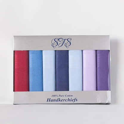 A boxed set of six folded handkerchiefs in assorted colors, including red, blue, light blue, navy, pale blue, lavender, and purple, presented in a silver-gray cardboard package with a clear window.