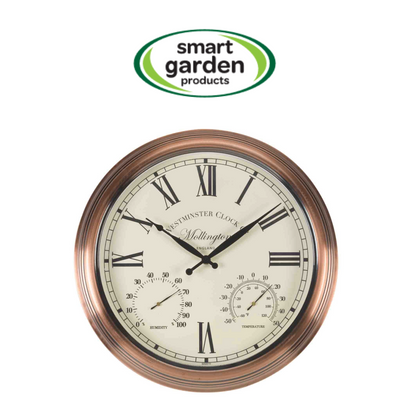 A round wall clock with a copper-toned metal frame, Roman numerals, black hands, and dual sub-dials on an off-white face. The clock is shown against a white background with a 'smart garden products' logo above it.