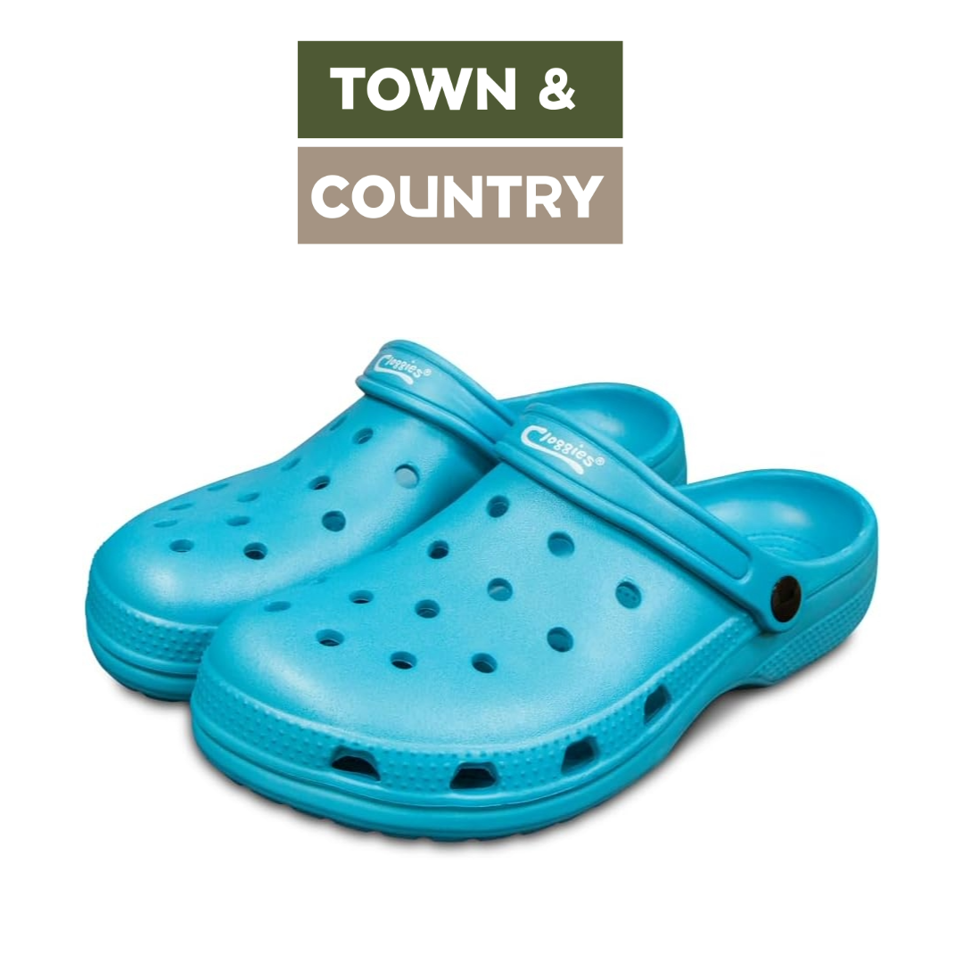 A pair of bright turquoise blue Crocfoot clogs with ventilation holes, displayed on a white background with a 'TOWN & COUNTRY' brand overlay at the top.