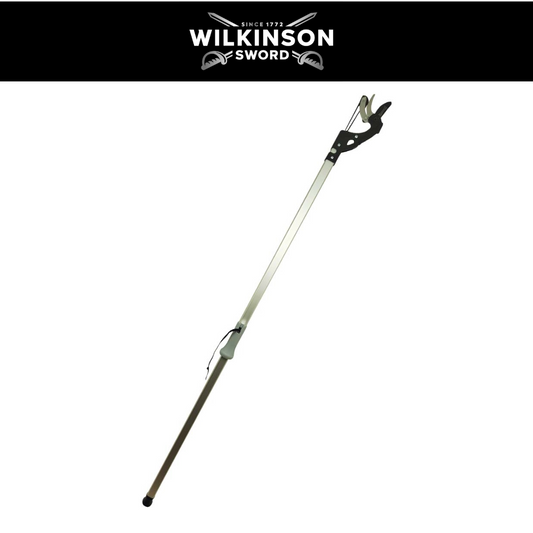 A long-handled Wilkinson sword with a silver metal shaft, black handle grip, and bronze-colored lower section, shown diagonally on a white background with a black header featuring the Wilkinson Sword logo.