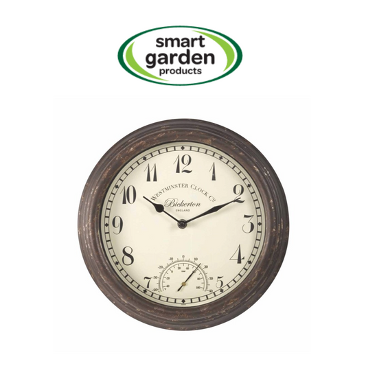 A round wall clock with a distressed dark brown wood frame and a cream-colored face, featuring black Arabic numerals and hands. A 'smart garden products' logo is displayed above the clock on a plain white background.