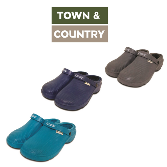 Three pairs of clog-style slip-on shoes from Town & Country shown on a white background, with the Town & Country logo at the top. The shoes are in teal blue, dark navy, and dark gray, with textured uppers and adjustable straps.