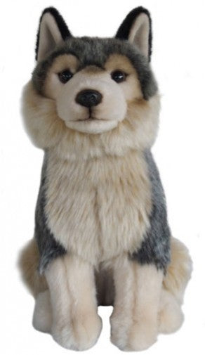 A plush toy dog with a realistic husky or alaskan Malamute design, featuring gray, black, cream, and tan fur, sitting against a plain white background.