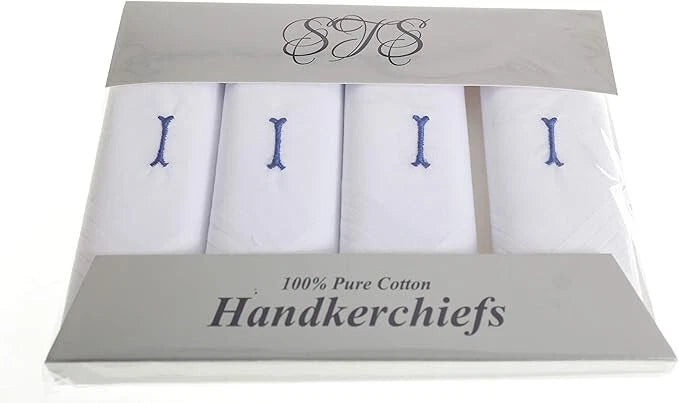 A 4-pack of white cotton handkerchiefs in a clear plastic clamshell package with a gray cardboard header and footer. Each handkerchief is folded and embroidered with a blue capital letter, and the packaging displays 'STS' and '100% Pure Cotton Handkerchiefs'.